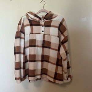 Neutral tan/brown/white hooded, long sleeve, pull over. Three buttons knit front